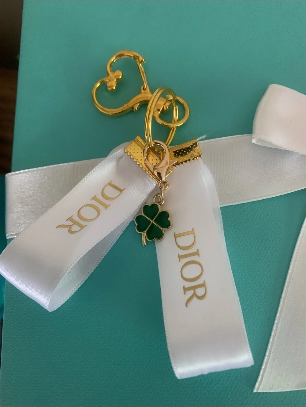 DIOR White Ribbon Key Ring with Gold & Green Clover Charm
